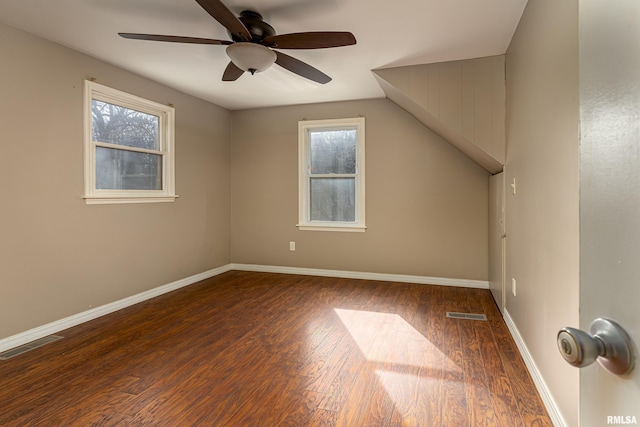 additional living space featuring a wealth of natural light, visible vents, and wood finished floors