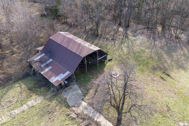 aerial view featuring a wooded view