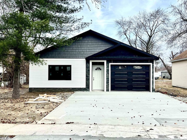 view of front facade featuring a garage and concrete driveway