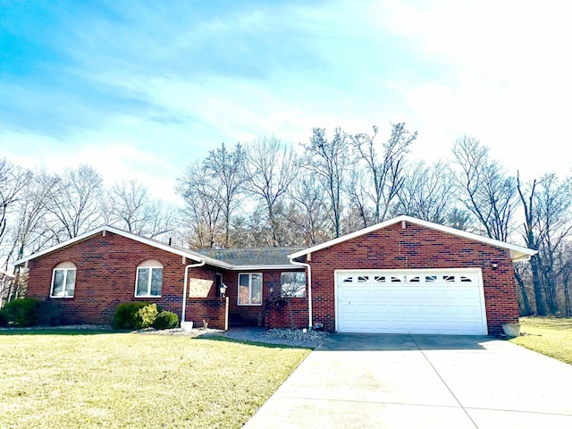 ranch-style house with brick siding, a garage, driveway, and a front yard