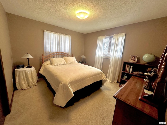 carpeted bedroom with a textured ceiling