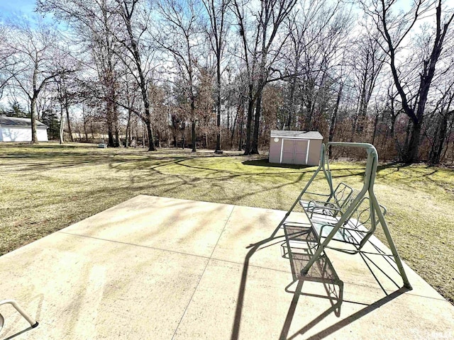 view of patio with a storage unit and an outdoor structure