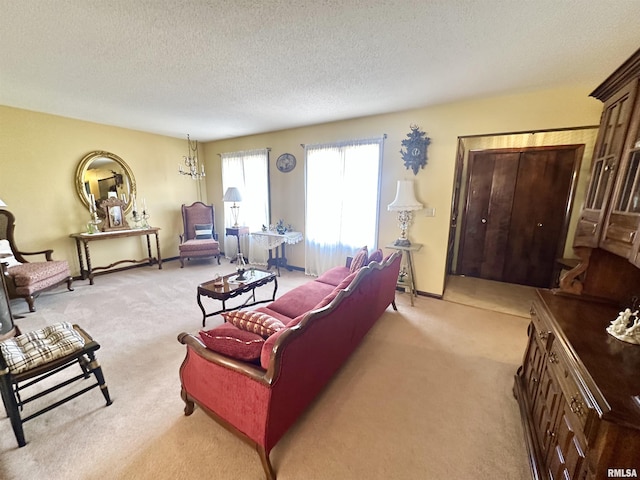 living room with light colored carpet and a textured ceiling