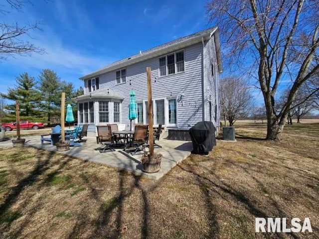 back of property with a patio area and cooling unit