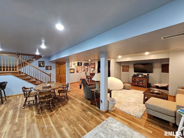 dining space featuring stairs, recessed lighting, wood finished floors, and visible vents