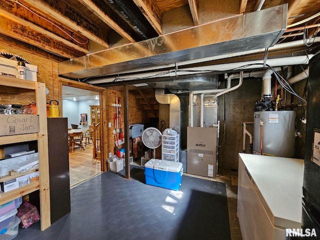 unfinished below grade area featuring heating unit and water heater