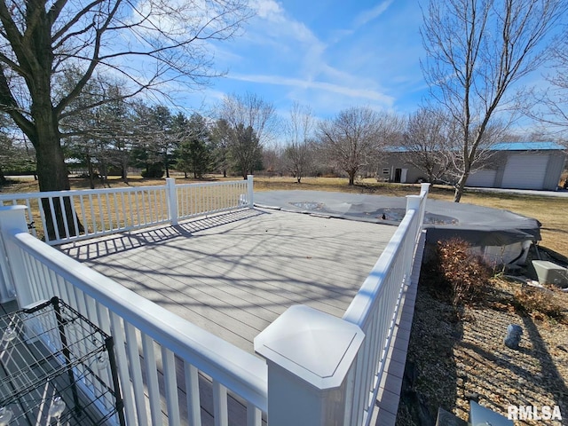 view of swimming pool with a deck