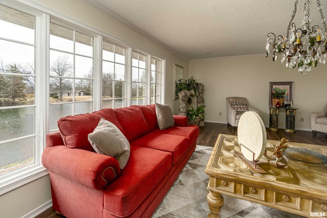 sunroom / solarium featuring a chandelier