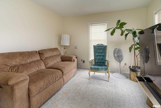 living room with baseboards and carpet flooring