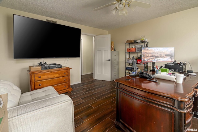 office featuring wood finish floors, a textured ceiling, and ceiling fan