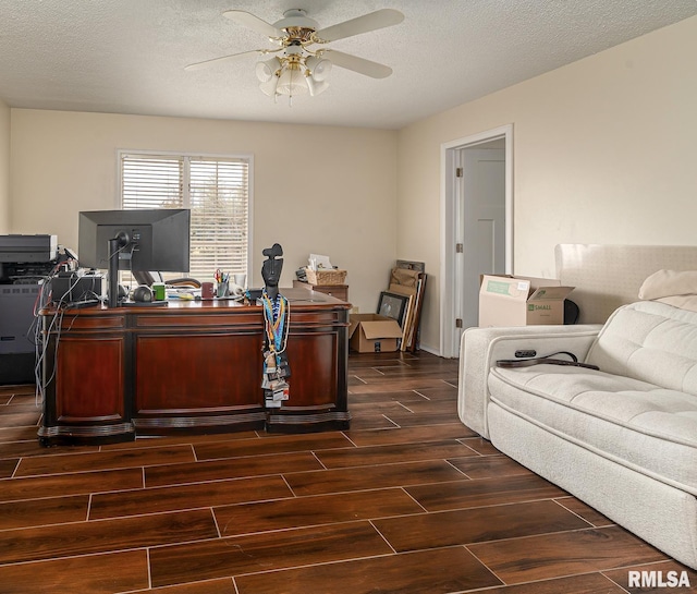 home office with wood finish floors, a textured ceiling, and a ceiling fan