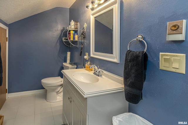 bathroom featuring toilet, a textured ceiling, tile patterned flooring, baseboards, and vanity