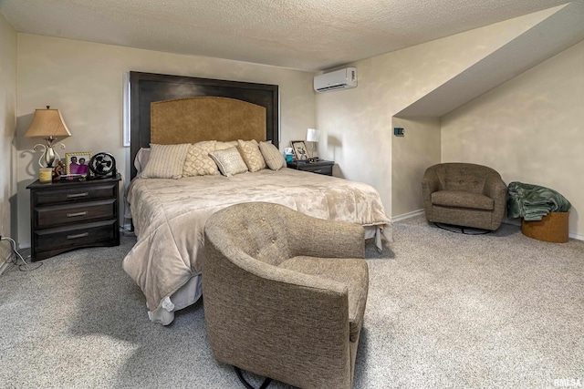 bedroom with an AC wall unit, carpet flooring, baseboards, and a textured ceiling