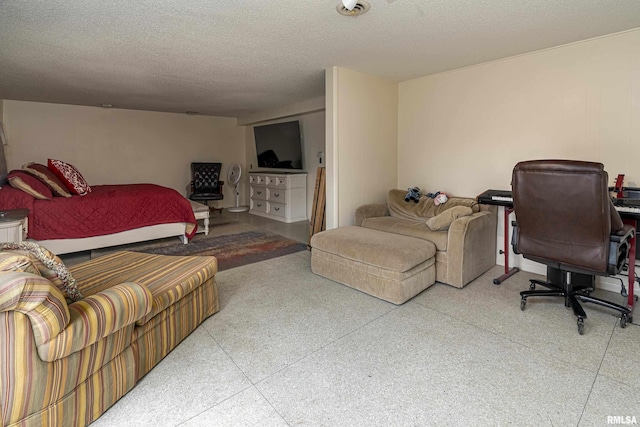 bedroom with light speckled floor and a textured ceiling