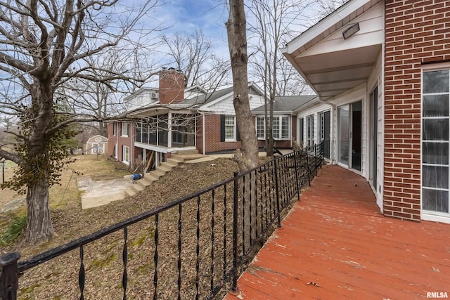 wooden deck featuring fence