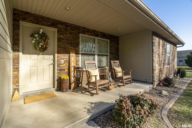 entrance to property featuring covered porch