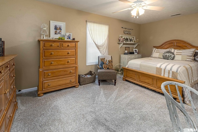 bedroom with light carpet, visible vents, baseboards, and a ceiling fan