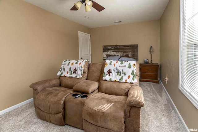 carpeted bedroom featuring visible vents, a ceiling fan, and baseboards