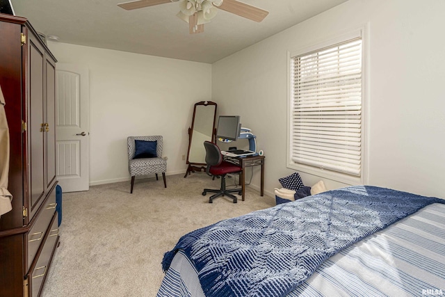 bedroom featuring light carpet, ceiling fan, and baseboards