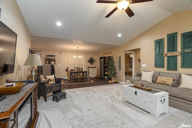 carpeted living area featuring recessed lighting, ceiling fan with notable chandelier, and vaulted ceiling