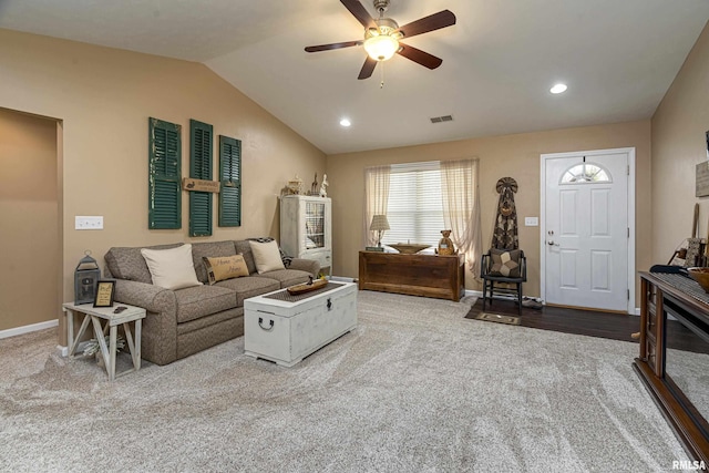 carpeted living area with baseboards, visible vents, recessed lighting, ceiling fan, and vaulted ceiling