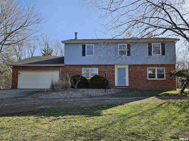 view of front of property featuring a front yard, a garage, brick siding, and driveway