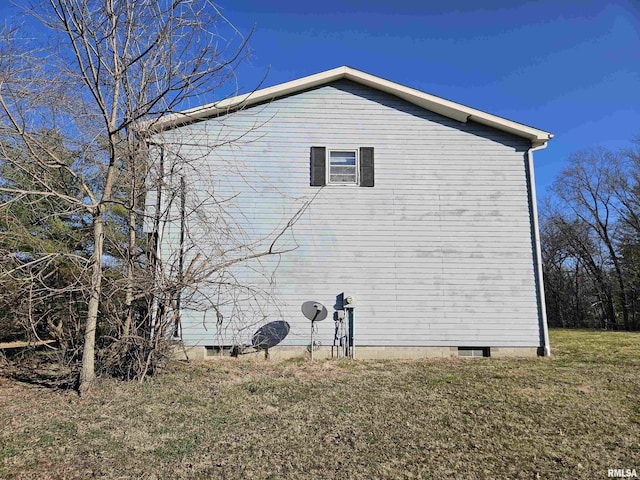 view of home's exterior featuring a yard