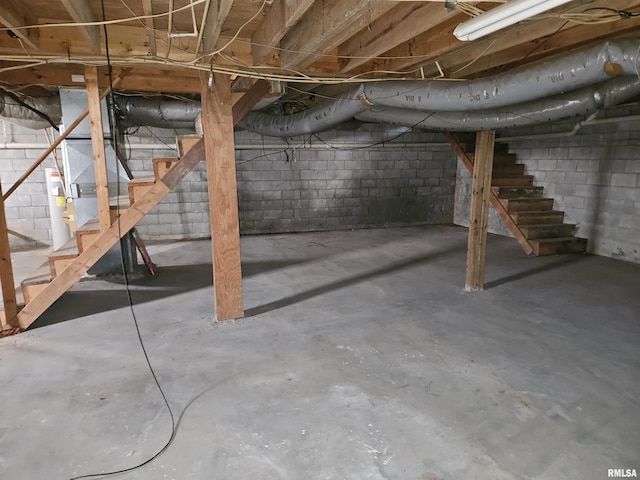 unfinished basement featuring stairs