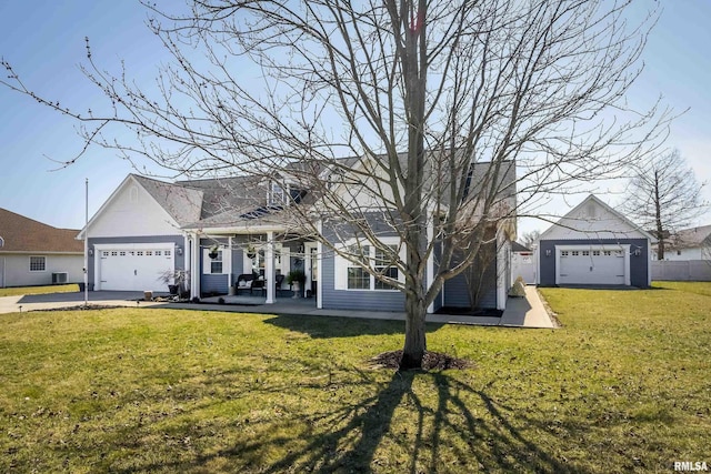 cape cod house with a front yard, an attached garage, and driveway