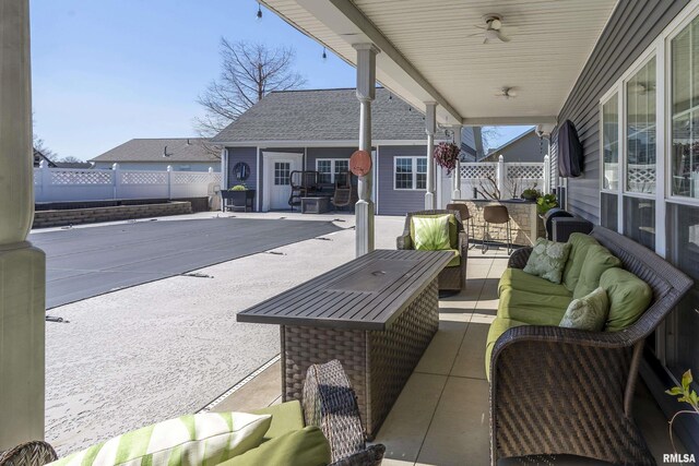 view of patio with an outdoor hangout area and fence