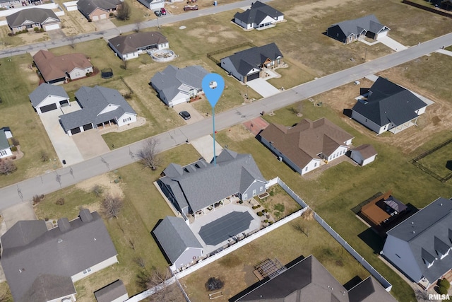 birds eye view of property with a residential view