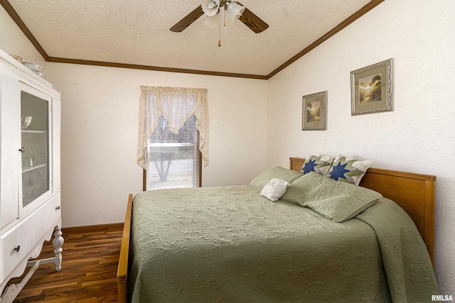 bedroom with a textured ceiling, wood finished floors, and ornamental molding