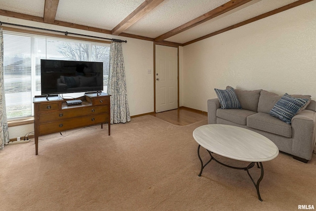 living room featuring vaulted ceiling with beams, carpet, baseboards, and a textured ceiling