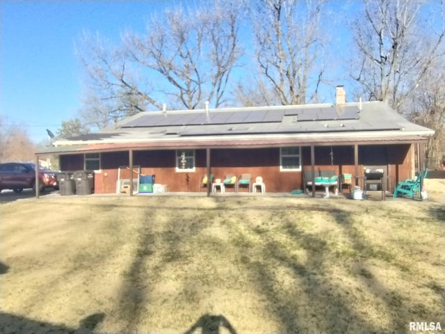 exterior space featuring an exterior structure, an outbuilding, and a chimney