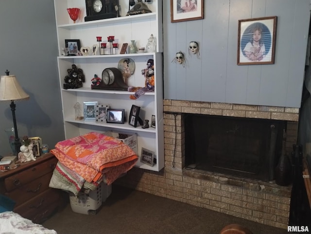 carpeted bedroom with a fireplace