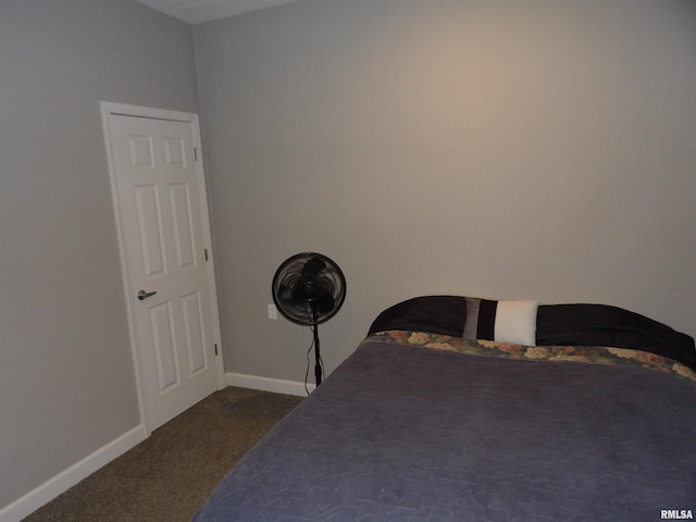 bedroom with baseboards and carpet floors