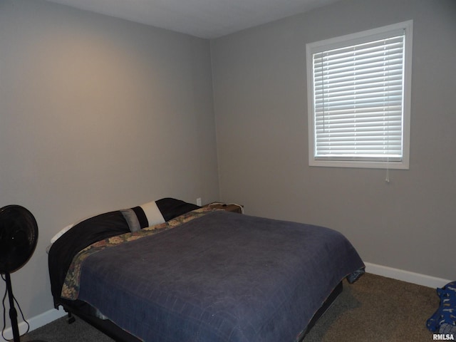 bedroom featuring baseboards and carpet floors