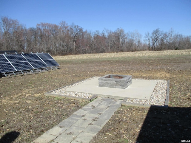 view of yard with a fire pit