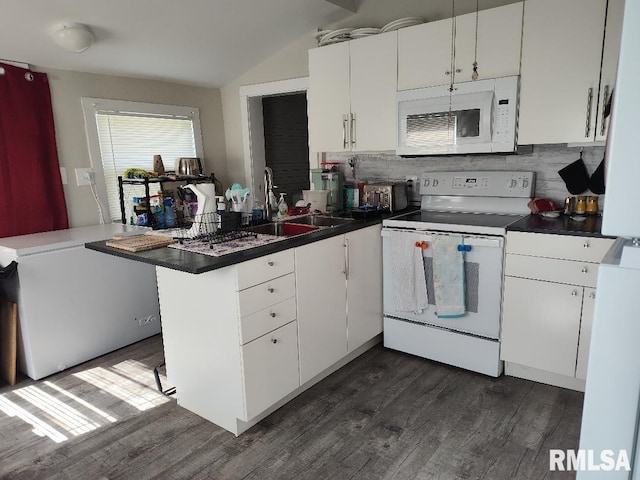 407 N Ohio St, Mound City, IL 62963 - kitchen featuring white appliances, dark wood-style floors, a peninsula, and a sink