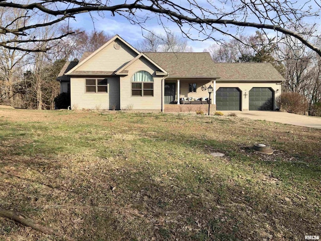 single story home featuring a front lawn, an attached garage, and driveway