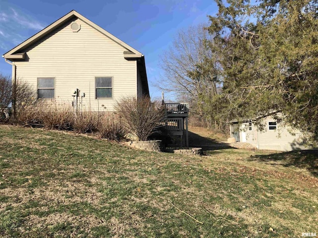 view of property exterior featuring a yard and a wooden deck