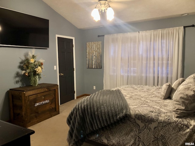 bedroom with lofted ceiling, baseboards, and carpet floors