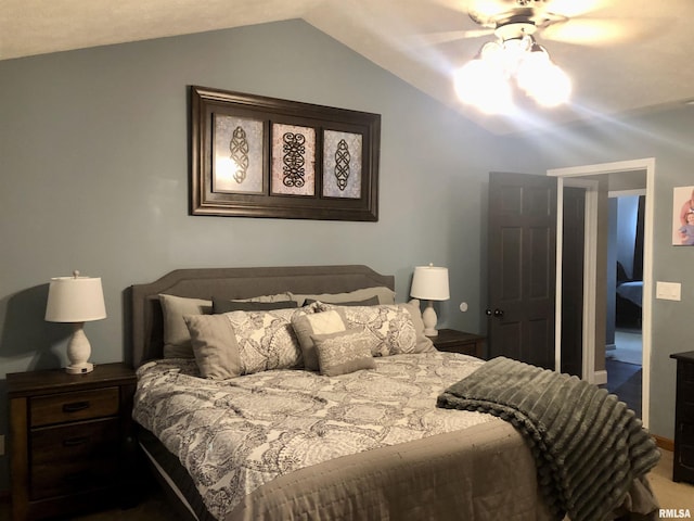 bedroom featuring vaulted ceiling and ceiling fan