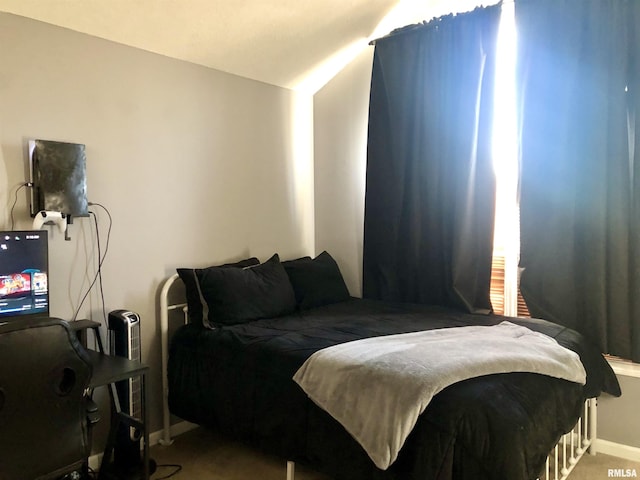 bedroom with vaulted ceiling