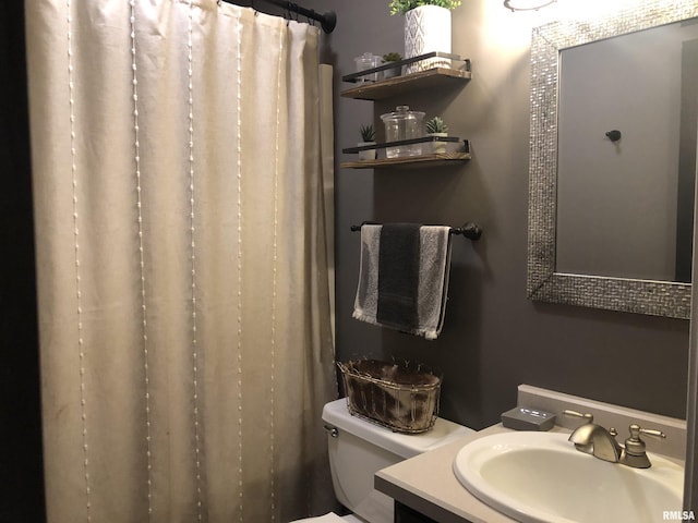 bathroom with vanity, toilet, and a shower with curtain