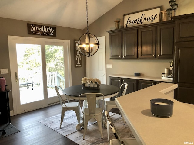 dining area with lofted ceiling and wood finished floors