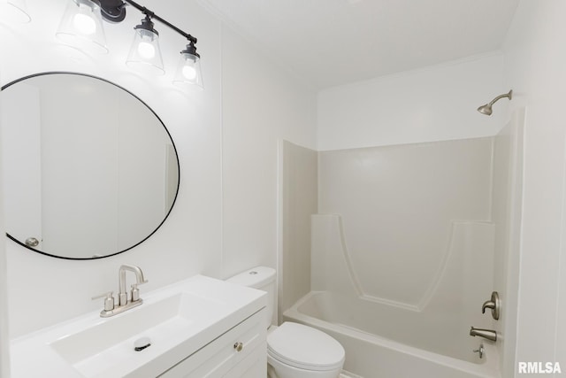 bathroom featuring bathing tub / shower combination, vanity, ornamental molding, and toilet