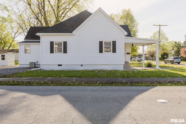 view of home's exterior featuring crawl space, roof with shingles, and central air condition unit