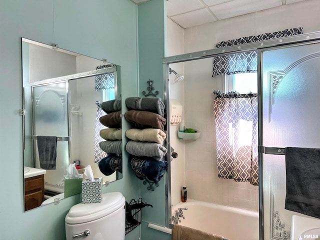 bathroom with toilet, a tub to relax in, and a shower with shower door