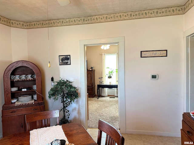 dining area featuring baseboards